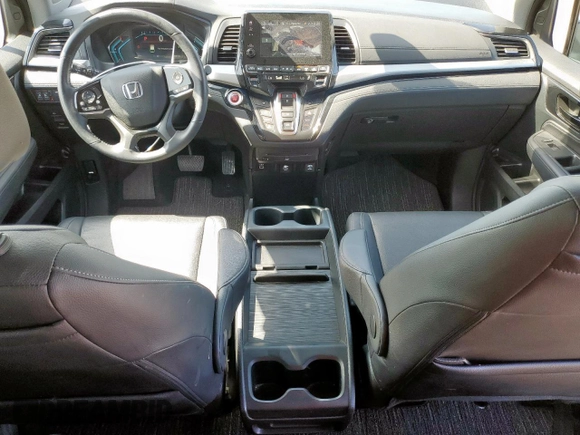 2023 Honda Odyssey Touring with VIN 5FNRL6H89PB053593, listed as a Copart auction lot 64836685 with 26,568 mi miles and Salvage title. Bid and sale history available at DreamBid. Image 8.