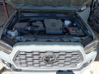 2023 Toyota Tacoma 4WD SR with VIN 3TMCZ5ANXPM613857, listed as a IAAI auction lot 41771957 with 76,232 mi miles. Bid and sale history available at carsss.com. Image 10.