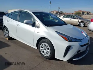 2021 Toyota Prius L Eco with VIN JTDKAMFU7M3133544, listed as a IAAI auction lot 41548653 with 115,214 mi miles. Bid and sale history available at carsss.com. Image 1.
