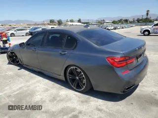 2018 BMW 7 Series 740i with VIN WBA7E2C59JG742809, listed as a Copart auction lot 66995934 with 62,017 mi miles and Salvage Title. Bid and sale history available at carsss.com. Image 2.