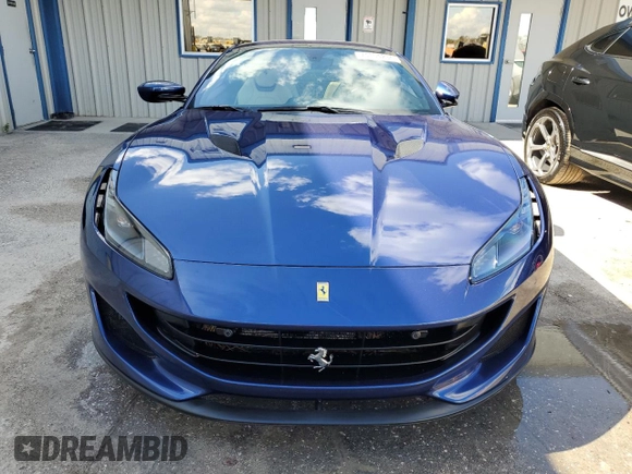 2019 Ferrari Portofino z VIN ZFF89FPAXK0242549, wystawiony jako Copart lot #74454234 z przebiegiem Nie podano mil oraz Nie do naprawy. Historia ofert i sprzedaży dostępna na DreamBid. Obrazek 5.