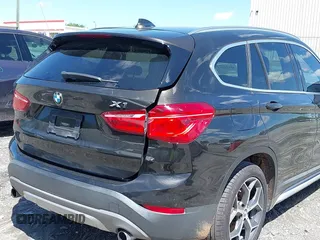 2016 BMW X1 xDrive28i with VIN WBXHT3C3XGP889833, listed as a IAAI auction lot 39118131 with 111,343 mi miles. Bid and sale history available at carsss.com. Image 13.