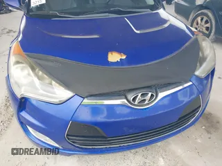 2012 Hyundai Veloster w/Gray Int z VIN KMHTC6AD0CU034683, wystawiony jako IAAI lot #42395112 z przebiegiem 134 388 mil mil oraz . Historia ofert i sprzedaży dostępna na DreamBid. Obrazek 13.