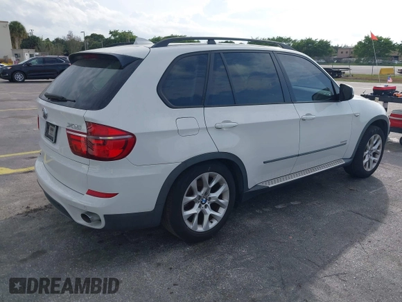 2011 BMW X5 35i with VIN 5UXZV4C54BL412770, listed as a IAAI auction lot 41618946 with 148,612 mi miles. Bid and sale history available at carsss.com. Image 4.