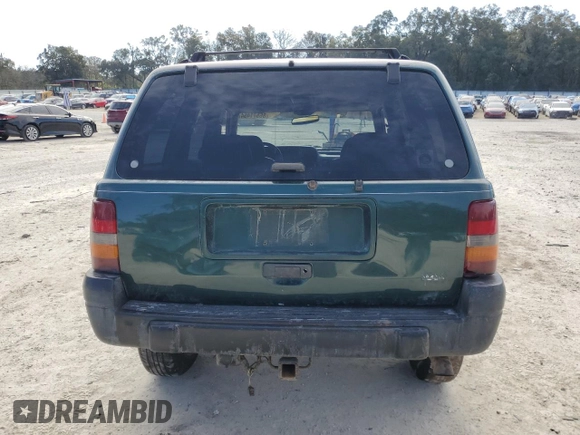 1996 Jeep Grand Cherokee Laredo with VIN 1J4GZ58S1TC340018, listed as a Copart auction lot 86571454 with 0 mi miles and Salvage Title. Bid and sale history available at carsss.com. Image 6.