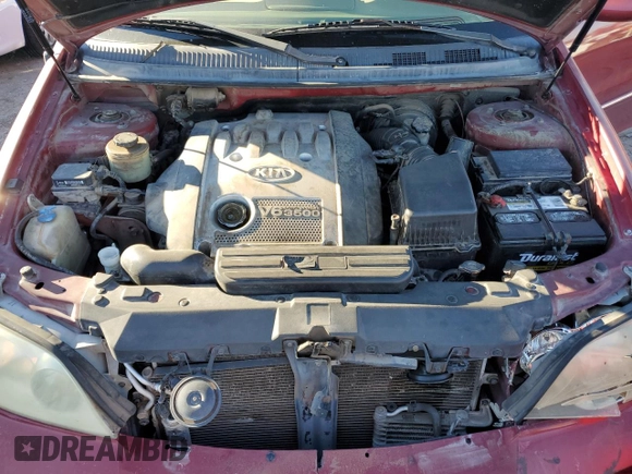 2005 Kia Sedona LX with VIN KNDUP132156669009, listed as a Copart auction lot 76936094 with 124,989 mi miles and Salvage Title. Bid and sale history available at carsss.com. Image 12.