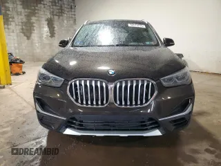 2020 BMW X1 xDrive28i z VIN WBXJG9C09L5P27471, wystawiony jako Copart lot #56573215 z przebiegiem 56 594 mil mil oraz Szkody całkowita. Historia ofert i sprzedaży dostępna na DreamBid. Obrazek 5.