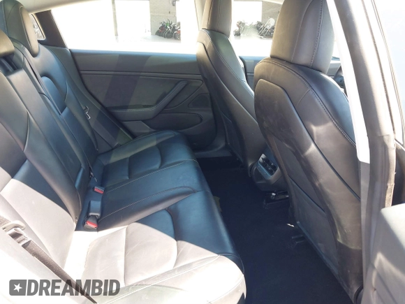 2019 Tesla Model 3 Mid Range with VIN 5YJ3E1EA0KF425079, listed as a IAAI auction lot 41871022 with 61,684 mi miles and . Bid and sale history available at DreamBid. Image 8.