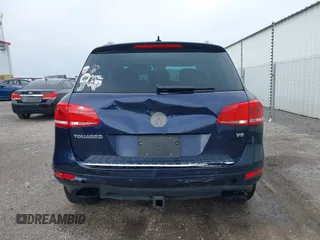 2013 Volkswagen Touareg Lux z VIN WVGEF9BP0DD000495, wystawiony jako IAAI lot #41711365 z przebiegiem 116 223 mil mil oraz . Historia ofert i sprzedaży dostępna na DreamBid. Obrazek 16.