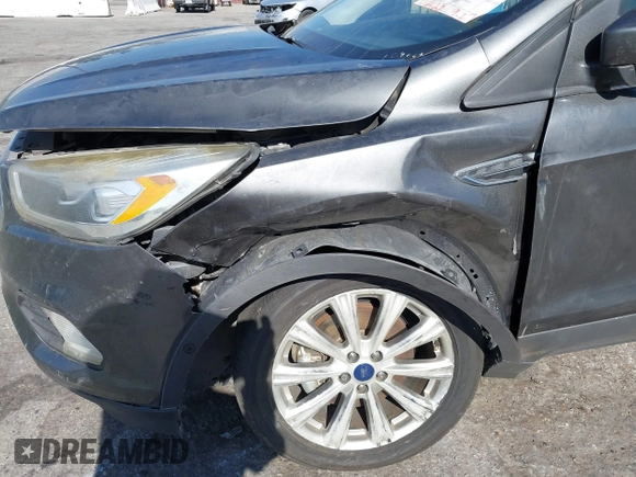 2018 Ford Escape Titanium with VIN 1FMCU0J98JUA03474, listed as a IAAI auction lot 37677880 with 106,423 mi miles and . Bid and sale history available at DreamBid. Image 6.
