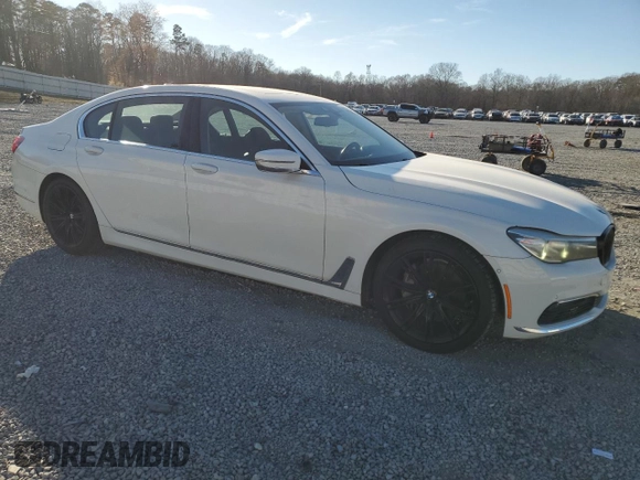 2017 BMW 7 Series 740i with VIN WBA7E2C32HG740649, listed as a Copart auction lot 45593145 with 122,793 mi miles and Salvage Title. Bid and sale history available at carsss.com. Image 4.