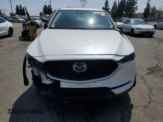 2018 Mazda CX-5 Grand Touring z VIN JM3KFADM3J1464073, wystawiony jako Copart lot #59571385 z przebiegiem Nie podano mil oraz Szkoda całkowita • Salvage title. Historia ofert i sprzedaży dostępna na DreamBid. Obrazek 5.