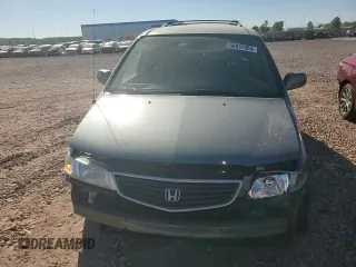 1999 Honda Odyssey EX with VIN 2HKRL1860XH541737, listed as a Copart auction lot 88897965 with 112,164 mi miles and Salvage title. Bid and sale history available at DreamBid. Image 11.