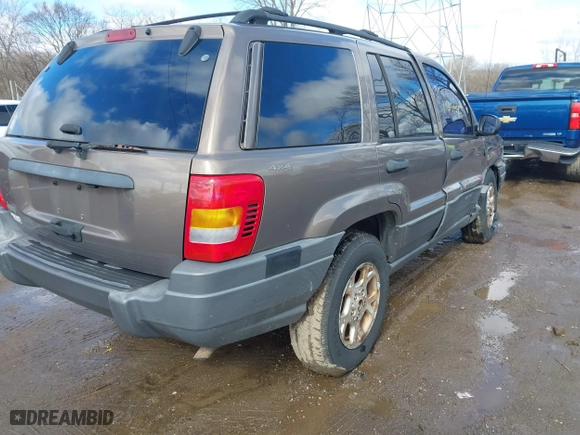 2001 Jeep Grand Cherokee Laredo with VIN 1J4GW48S21C572272, listed as a IAAI auction lot 41695754 with 169,229 mi miles. Bid and sale history available at carsss.com. Image 4.