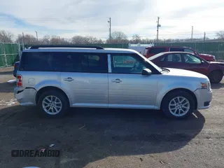 2016 Ford Flex SE z VIN 2FMGK5B8XGBA23900, wystawiony jako IAAI lot #41599714 z przebiegiem 102 961 mil mil oraz . Historia ofert i sprzedaży dostępna na DreamBid. Obrazek 13.