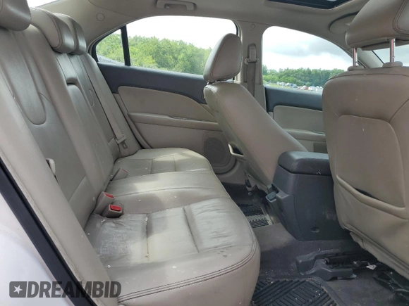 2010 Ford Fusion Hybrid with VIN 3FADP0L36AR203663, listed as a Copart auction lot 60310095 with 211,922 mi miles and Salvage title. Bid and sale history available at DreamBid. Image 10.