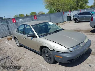 1996 Saturn SL with VIN 1G8ZH5288TZ230864, listed as a IAAI auction lot 42116703 with 104,387 mi miles. Bid and sale history available at carsss.com. Image 1.