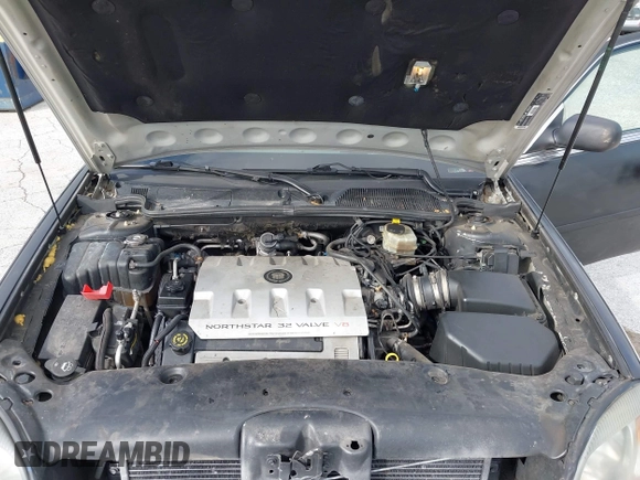 2002 Cadillac DeVille DHS z VIN 1G6KE57Y62U233642, wystawiony jako IAAI lot #42132517 z przebiegiem 223 505 mil mil oraz . Historia ofert i sprzedaży dostępna na DreamBid. Obrazek 10.