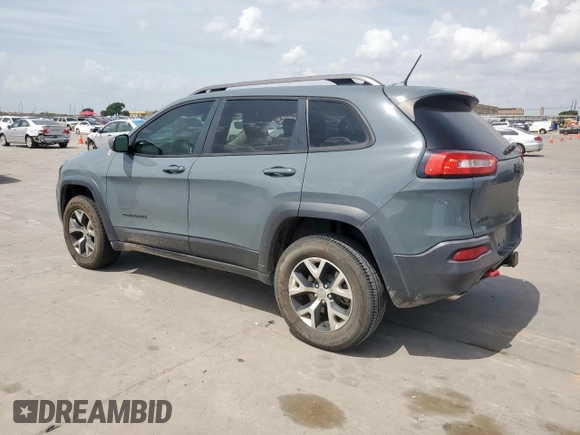 2014 Jeep Cherokee Trailhawk with VIN 1C4PJMBS0EW185737, listed as a Copart auction lot 63463015 with 199,983 mi miles and Clean title. Bid and sale history available at DreamBid. Image 2.
