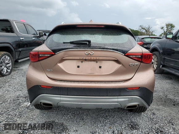 2018 Infiniti QX30 Premium with VIN SJKCH5CR7JA041151, listed as a Copart auction lot 65256585 with 129,102 mi miles and Salvage title. Bid and sale history available at DreamBid. Image 6.