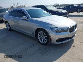 2016 BMW 7 Series 740i with VIN WBA7E2C5XGG739099, listed as a IAAI auction lot 41526038 with 123,900 mi miles. Bid and sale history available at carsss.com. Image 1.