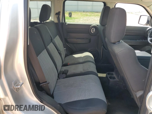 2008 Dodge Nitro SXT z VIN 1D8GU28K98W178732, wystawiony jako Copart lot #61411305 z przebiegiem 185 194 mil mil oraz Czysty tytuł • Clean title. Historia ofert i sprzedaży dostępna na DreamBid. Obrazek 11.