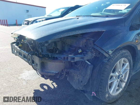2015 Ford Focus SE with VIN 1FADP3F21FL385654, listed as a IAAI auction lot 42306171 with 187,725 mi miles and . Bid and sale history available at DreamBid. Image 12.
