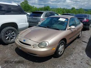 1997 Ford Taurus GL z VIN 1FALP52U9VA280563, wystawiony jako IAAI lot #42045413 z przebiegiem 219 484 mil mil oraz . Historia ofert i sprzedaży dostępna na DreamBid. Obrazek 13.