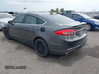2018 Ford Fusion Titanium z VIN 3FA6P0K9XJR160993, wystawiony jako IAAI lot #41938148 z przebiegiem 137 410 mil mil oraz . Historia ofert i sprzedaży dostępna na DreamBid. Obrazek 3.