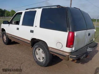 1997 Chevrolet Tahoe with VIN 1GNEK13R3VJ416827, listed as a IAAI auction lot 42041780 with 143,566 mi miles. Bid and sale history available at carsss.com. Image 3.