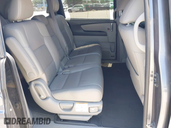 2014 Honda Odyssey EX-L z VIN 5FNRL5H69EB095297, wystawiony jako IAAI lot #42299438 z przebiegiem 126 841 mil mil oraz . Historia ofert i sprzedaży dostępna na DreamBid. Obrazek 8.