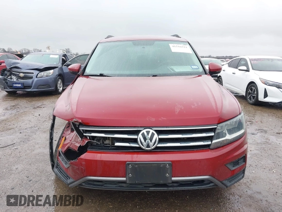 2018 Volkswagen Tiguan S with VIN 3VV1B7AX8JM124827, listed as a IAAI auction lot 41544321 with 101,492 mi miles and . Bid and sale history available at DreamBid. Image 12.