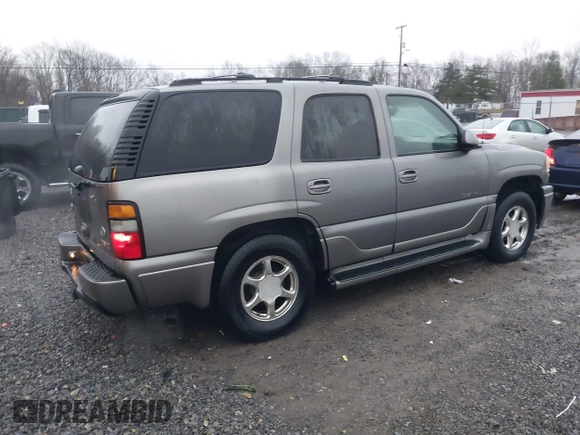 2005 GMC Yukon Denali z VIN 1GKEK63U25J228296, wystawiony jako IAAI lot #40980307 z przebiegiem 192 353 mil mil oraz . Historia ofert i sprzedaży dostępna na DreamBid. Obrazek 4.