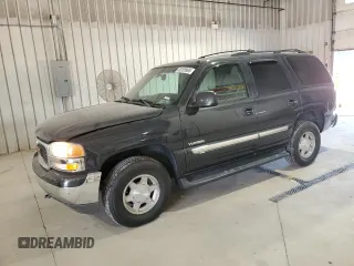 2003 GMC Yukon SLT z VIN 1GKEK13ZX3J223679, wystawiony jako Copart lot #62259995 z przebiegiem 259 233 mil mil oraz Szkoda całkowita • Salvage title. Historia ofert i sprzedaży dostępna na DreamBid. Obrazek 1.