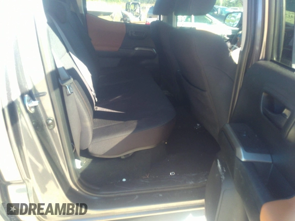 2018 Toyota Tacoma SR5 with VIN 5TFAZ5CN0JX056706, listed as a IAAI auction lot 41774141 with 31,738 mi miles and . Bid and sale history available at DreamBid. Image 8.