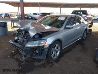 2014 Volkswagen Passat Wolfsburg Ed with VIN 1VWAT7A38EC051892, listed as a IAAI auction lot 41523058 with 122,493 mi miles. Bid and sale history available at carsss.com. Image 2.