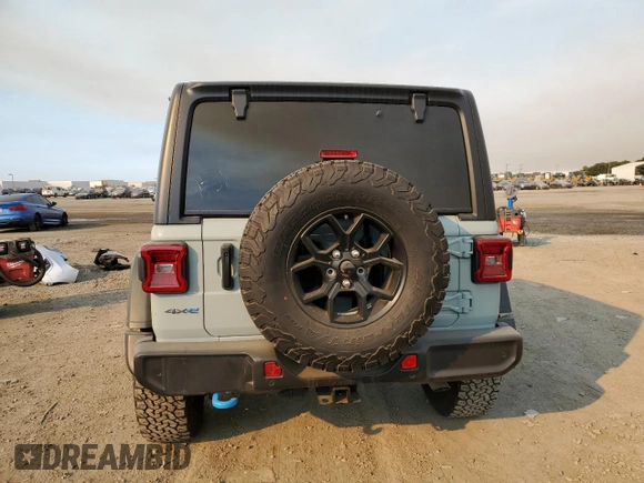 2024 Jeep Wrangler Sport S z VIN 1C4RJXN66RW167175, wystawiony jako Copart lot #42211795 z przebiegiem 14 102 mil mil oraz Szkoda całkowita • Salvage title. Historia ofert i sprzedaży dostępna na DreamBid. Obrazek 6.