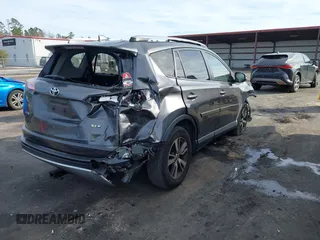 2018 Toyota RAV4 XLE with VIN JTMWFREV1JJ169926, listed as a IAAI auction lot 41464920 with 111,144 mi miles. Bid and sale history available at carsss.com. Image 4.