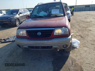 2002 Suzuki Grand Vitara JLX z VIN JS3TD62V824152943, wystawiony jako IAAI lot #41668395 z przebiegiem 104 191 mil mil oraz . Historia ofert i sprzedaży dostępna na DreamBid. Obrazek 13.