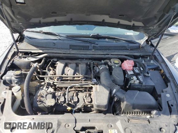 2015 Ford Taurus Limited с VIN 1FAHP2F86FG127106, выставлен на аукционе Copart как лот 61724995 с пробегом 90 343 миль миль и Чистый • Clean title. История ставок и продаж доступна на DreamBid. Изображение 12.