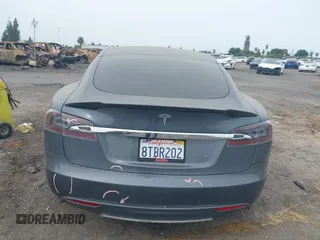 2013 Tesla Model S with VIN 5YJSA1AG5DFP13149, listed as a IAAI auction lot 42116437 with 140,999 mi miles. Bid and sale history available at carsss.com. Image 17.