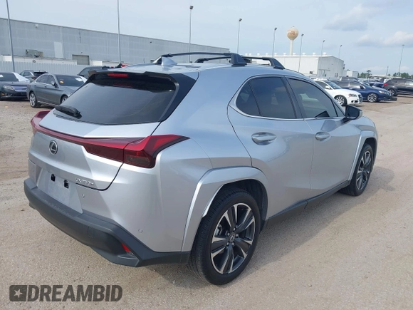 2023 Lexus UX 250h Premium z VIN JTHP6JBH5P2145912, wystawiony jako IAAI lot #42401353 z przebiegiem 14 252 mil mil oraz . Historia ofert i sprzedaży dostępna na DreamBid. Obrazek 4.