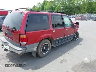 2000 Ford Explorer XLT z VIN 1FMZU73E7YZB60956, wystawiony jako IAAI lot #42218666 z przebiegiem 234 289 mil mil oraz . Historia ofert i sprzedaży dostępna na DreamBid. Obrazek 4.