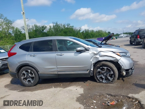 2018 Honda CR-V Touring with VIN 7FARW1H90JE012526, listed as a IAAI auction lot 42055078 with 96,098 mi miles and . Bid and sale history available at DreamBid. Image 13.