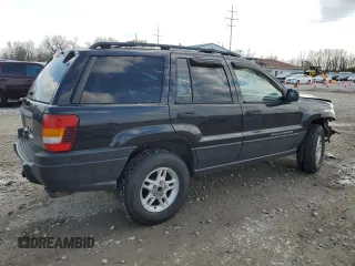 2004 Jeep Grand Cherokee Laredo with VIN 1J4GW48S84C184757, listed as a Copart auction lot 52895745 with 242,307 mi miles and Salvage Title. Bid and sale history available at carsss.com. Image 3.