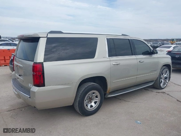 2015 Chevrolet Suburban LTZ with VIN 1GNSKKKC0FR525772, listed as a IAAI auction lot 41745084 with 187,981 mi miles. Bid and sale history available at carsss.com. Image 4.