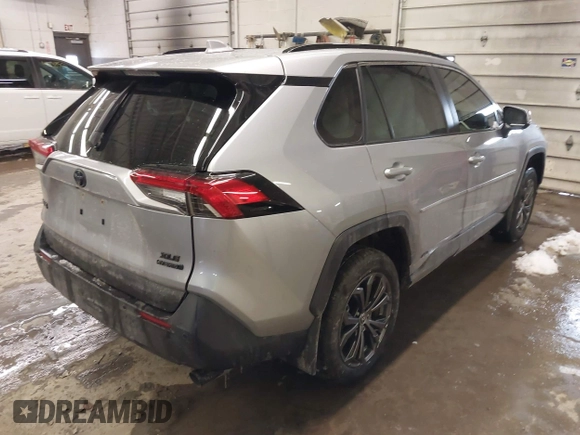 2024 Toyota RAV4 Hybrid XLE Premium with VIN JTMB6RFV5RD148973, listed as a IAAI auction lot 41516422 with 8,797 mi miles. Bid and sale history available at carsss.com. Image 4.