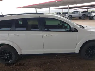 2019 Dodge Journey SE with VIN 3C4PDCBB7KT797842, listed as a IAAI auction lot 42036147 with 163,919 mi miles and . Bid and sale history available at DreamBid. Image 13.