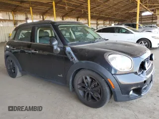 2011 MINI Countryman S with VIN WMWZC5C54BWM10218, listed as a Copart auction lot 60557685 with 192,422 mi miles and Salvage title. Bid and sale history available at DreamBid. Image 4.