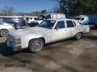 1989 Cadillac Brougham z VIN 1G6DW51Y4KR705970, wystawiony jako Copart lot #48423395 z przebiegiem 43 457 mil mil oraz Tytuł czysty. Historia ofert i sprzedaży dostępna na DreamBid. Obrazek 1.